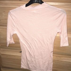 tight pink short sleeve turtleneck